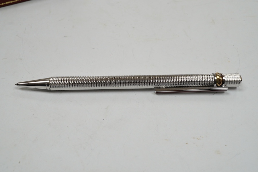 A Cartier pen, 14cm long, boxed. Condition - good